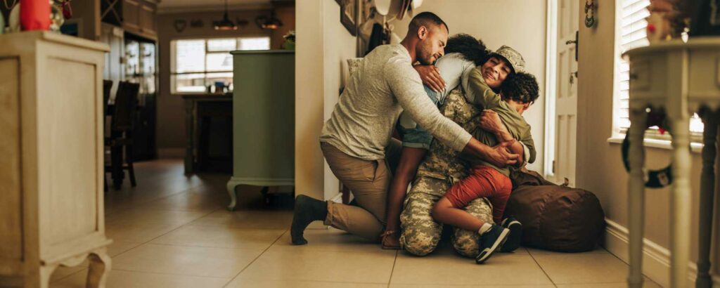 Family group hug during a much-awaited military homecoming